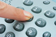 Photo: Phone keypad and finger Phone keypad and finger