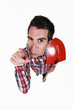 Angry tradesman pointing his finger in blame Angry tradesman pointing his finger in blame