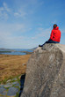 Hiker making a rest on the way to Diamond Hill, Ireland