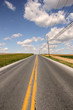 country road to freedom with yellow line