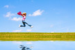Woman jumps on the meadow
