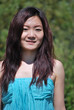 Portrait of Asian girl with a light blue dress in the  forest3