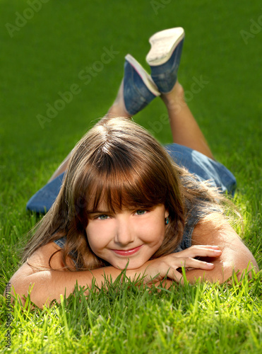 Photo: Child Outdoors in the Grass Child Outdoors in the Grass