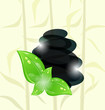 Meditative bamboo background with cairn stones and eco green lea Meditative bamboo background with cairn stones and eco green lea