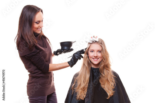 Foto: young stylist and blonde woman young stylist and blonde woman