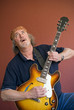 Mature guitarist searching for the high notes Mature guitarist searching for the high notes