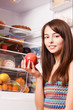 smile girl with pomegranate  on the kitchen