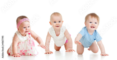 Photo: Funny babies go down on all fours. Competition concept. Funny babies go down on all fours. Competition concept.