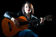 Woman Playing Classical Guitar in a Concert