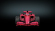 Formula One red bolide rotating on black background.