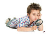 Attentive little boy with weird hair researching the bug using m Attentive little boy with weird hair researching the bug using m
