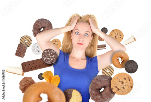 Photo: Diet Scare Woman on White with Snack Food Diet Scare Woman on White with Snack Food