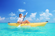 A woman kayaking on a sunny day
