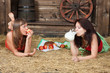 Young girls have lunch on a hayloft