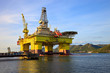 Photo: Oil rig near the mountains in Norway. Oil rig near the mountains in Norway.