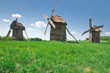 ancient windmills in field