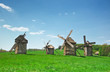 ancient windmills in field