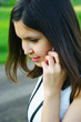 girl talks by a mobile phone