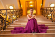 woman in a long dress on the stairs