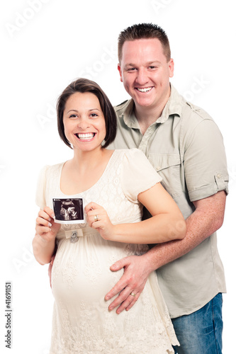Photo: Happy pregnant couple with ultrasound picture Happy pregnant couple with ultrasound picture