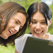 Young couple working with laptop, outdoor Young couple working with laptop, outdoor