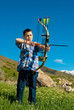 Photo: A young boy shooting archery A young boy shooting archery
