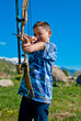 Photo: A young boy shooting archery A young boy shooting archery