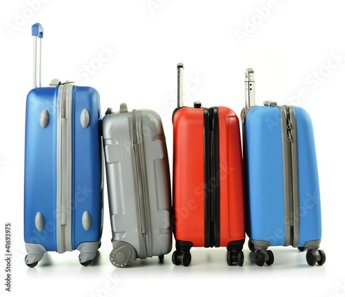 Photo: Luggage consisting of four suitcases isolated on white Luggage consisting of four suitcases isolated on white