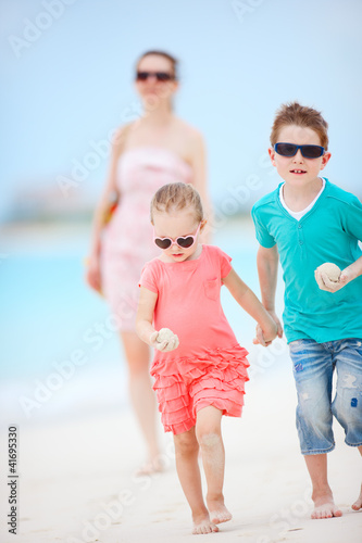 Photo: Family on tropical beach vacation Family on tropical beach vacation