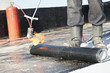 Flat roof covering works with roofing felt