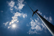 Wind Turbine with path on green field with blue sky Wind Turbine with path on green field with blue sky