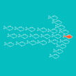 School of fish swimming in shape of arrow