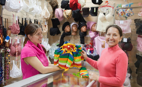 Photo: Saleswoman and custome at counter shop Saleswoman and custome at counter shop