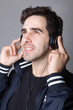 portrait of a young man listening to music with headphones portrait of a young man listening to music with headphones