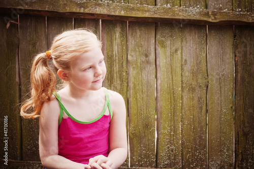 Photo: smile girl on wooden background smile girl on wooden background