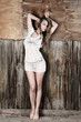 Young woman near wall