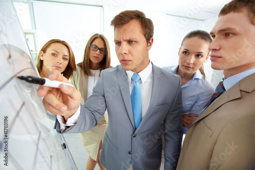Photo: Pointing at whiteboard Pointing at whiteboard