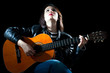 Woman Playing Classical Guitar in a Concert