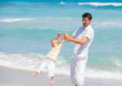 Father and son having fun on beach Father and son having fun on beach