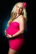Young pregnant mother with her tummy