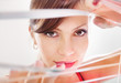 woman looking through jalousie