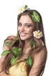 Beautiful young woman with flowers, leaves in her hair and origi Beautiful young woman with flowers, leaves in her hair and origi