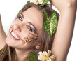 Beautiful young woman with flowers, leaves in her hair and origi Beautiful young woman with flowers, leaves in her hair and origi