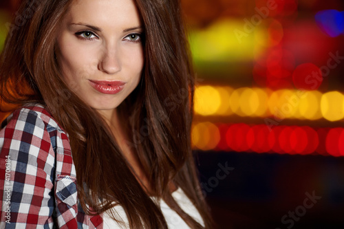 Photo: Portrait of beautiful petite woman in night city. Shallow DOF. Portrait of beautiful petite woman in night city. Shallow DOF.