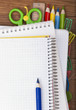 School or office tools on wooden board School or office tools on wooden board