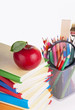 Red apple, books and colored pencil isolated on white Red apple, books and colored pencil isolated on white