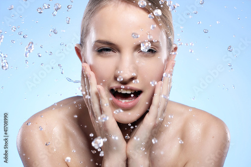 Photo: Beautiful woman washing her face Beautiful woman washing her face