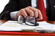Close-up of eyeglasses pn a desk