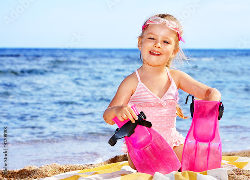Photo: Child playing on beach. Child playing on beach.