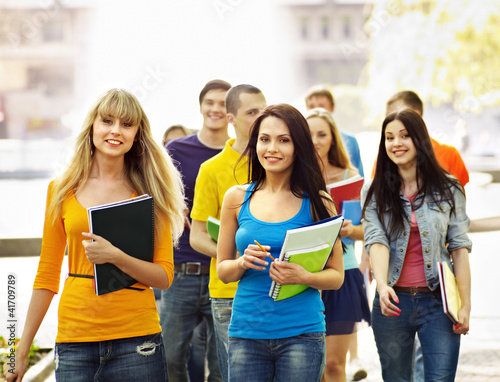 Photo: Group student with notebook outdoor. Group student with notebook outdoor.